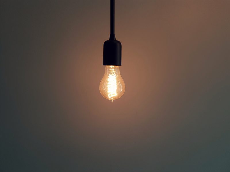 light bulb hanging in an empty room
