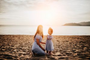 woman and girl by the sea