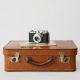 old suitcase with a camera on top