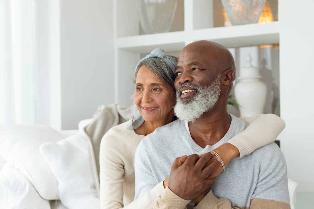 happy retired couple seeking retirement financial planning